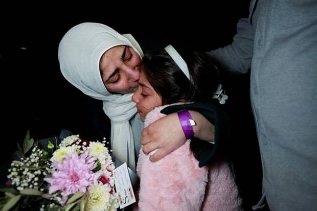 A freed Palestinian prisoner greets her child after her release from an Israeli jail as part of a hostages-prisoners swap. (Photo source: Reuters)