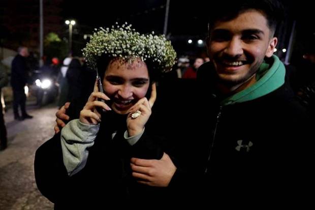 A freed Palestinian prisoner speaks on a phone after being released from an Israeli jail as part of a hostages-prisoners swap and a ceasefire deal in Gaza in Ramallah. (Photo source: Reuters)