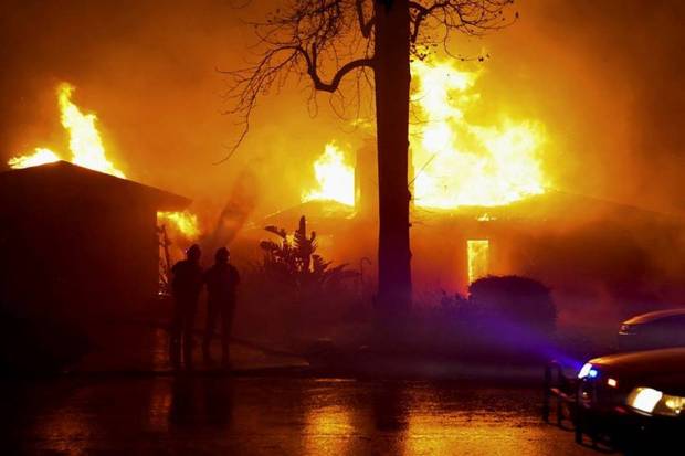 Firefighters work to extinguish flames as the Eaton Fire burns in Pasadena, California, US on January 8, 2025. (Photo source: Reuters)