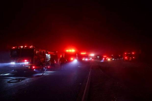 Firefighting vehicles stand on the road as the Eaton Fire burns in Pasadena, California, US January 7, 2025. (Photo source: Reuters)