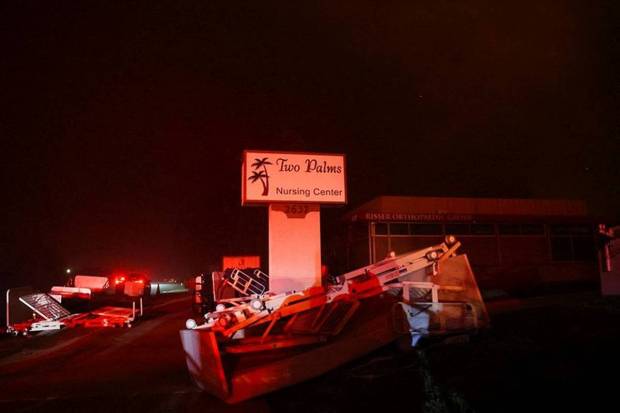 A sign for the Two Palms Nursing Centre, which was burnt by the Eaton Fire, stands as the wildfire burns, in Pasadena. (Photo source: Reuters)