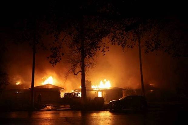 Flames rise from buildings as the Eaton Fire burns in Pasadena. (Photo source: Reuters)