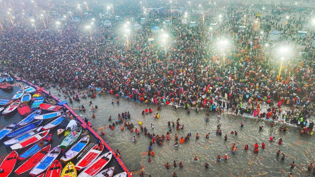 Devotees take a holy dip at Sangam during Maha Kumbh Mela 2025, in Prayagraj, Uttar Pradesh.