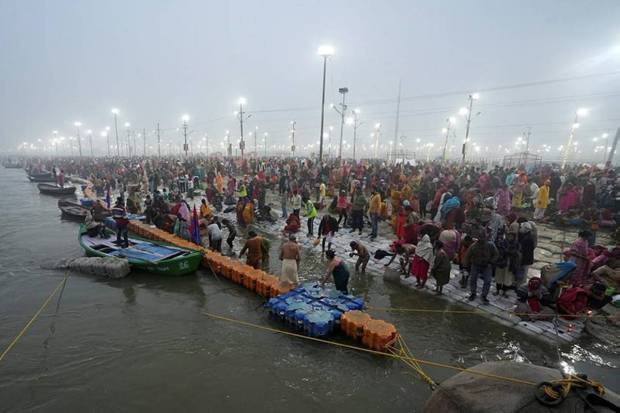 Devotees gather on the day they take a holy dip at Sangam, the confluence of the Ganges, Yamuna and Saraswati rivers in Prayagraj. (Photo source: Reuters)