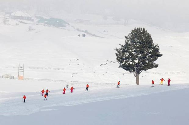 Skiers ski in a snow-covered field in Gulmarg, a ski resort and one of the main tourist attractions in the Kashmir region. (Photo source: Reuters)