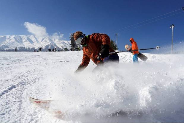 A skiing instructor shows his skills during a training session, after fresh snowfall at the ski resort of Gulmarg in Baramulla district of North Kashmir, Tuesday, January 7, 2025. (Photo source: PTI)