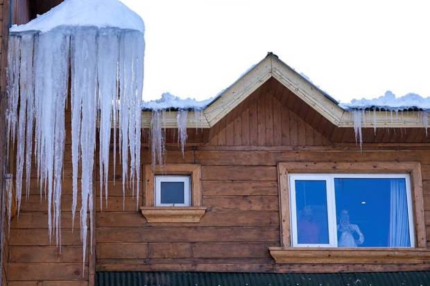 Icicles hang from the rooftop of a hotel building after fresh snowfall, at ski resort of Gulmarg, in Baramulla district of North Kashmir. (Photo source: PTI)