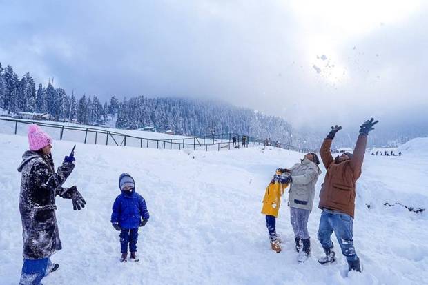 Tourists after fresh snowfall, at ski resort of Gulmarg, in Baramulla district of North Kashmir. (Photo source: PTI)