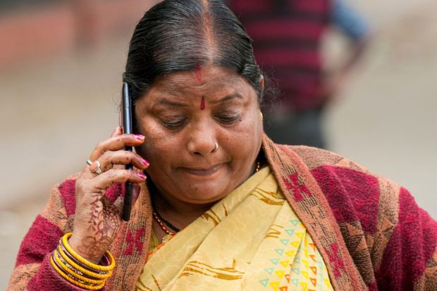 A woman from Bihar's Chapra who died in the New Delhi railway station stampede, mourns outside the mortuary at the Lok Nayak Jai Prakash (LNJP) Hospital. (Image: PTI)