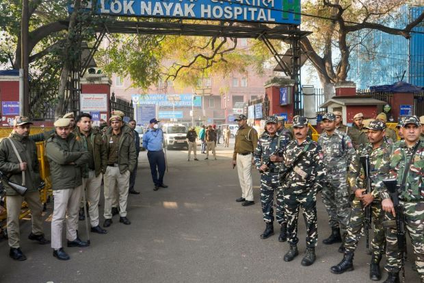 To guard the premises of the LNJP Hospital, security personnel were deployed to assist families and manage the crisis at hand. (Image: PTI)