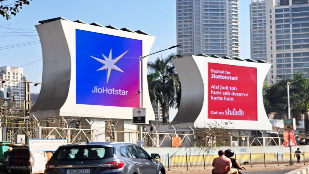 The billboard celebrating the new partnership- JioHotstar.