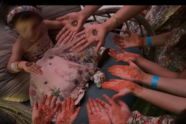Just before the wedding, attended by Priyanka Chopra Jonas and daughter, Malti were at a close-knit terrace mehendi event with close friends and family. The two year old seemed interested in the henna tattoos everyone sported. (Image: Instagram)