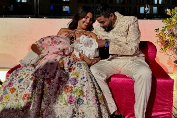 In custom Rahul Mishra couture, Priyanka Chopra turned heads and caught eyeballs with her everygreen fashion sense. Sharing a moment of laughter and happiness with her brother playing with her neice, Malti. (Image: Instagram)