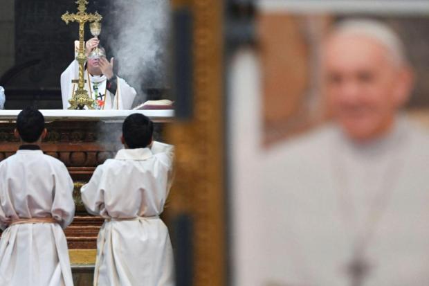 Members of the clergy celebrate Mass in memory of Pope Francis, following the death of the pontiff, at the Metropolitan Cathedral of Our Lady of Peace, in La Paz, Bolivia.