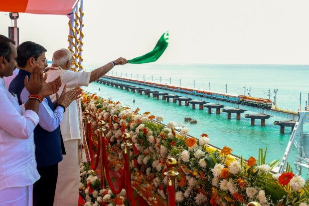 Rameswaram: A train crosses the newly-inaugurated Pamban sea bridge during the flag-off of the Rameswaram–Tambaram (Chennai) train service by Prime Minister Narendra Modi. (Image: PTI)