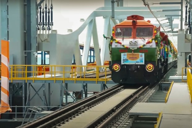 Rameswaram: A train passes over the newly-inaugurated Pamban sea bridge during the flag-off of the Rameswaram–Tambaram (Chennai) train service by Prime Minister Narendra Modi. (Image: PTI)