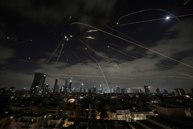 On Friday, June 13, Israel launched airstrikes on Iran, targeting multiple nuclear and military facilities under what Prime Minister Benjamin Netanyahu called “Operation Rising Lion”.  It is one of the biggest attacks on Iran in decades, as an attempt to remove the “nuclear threat” to Israel. On Sunday, Israel launched an expanded assault on Iran with direct strikes targeting its energy industry and Defence Ministry headquarters. The two countries entered into the fourth day of the conflict on Monday, with Iran launching a new wave of missile attacks on Israel. (Photo Source - AP/PTI)