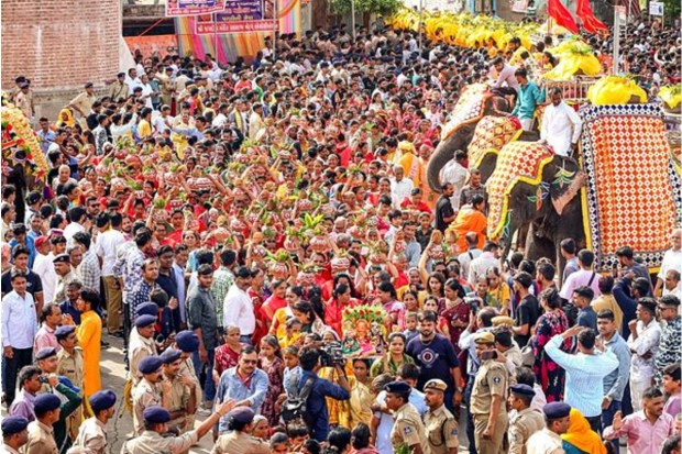 Participants carrying earthen pots are part of the Jal Yatra procession of Lord Jagannath at the Sabarmati riverfront in Ahmedabad. (Image Source: PTI)