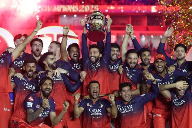 Royal Challengers Bengaluru's Rajat Patidar lifts the trophy as he celebrates with teammates after winning the Indian Premier League. (Photo source: Reuters)