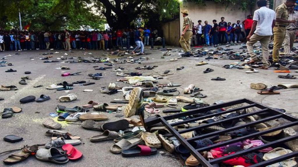 Footwears lie on the ground outside the Chinnaswamy Stadium following a stampede after a large number of fans gathered for the felicitation of IPL 2025 winning Royal Challengers Bengaluru team (PTI Photo)