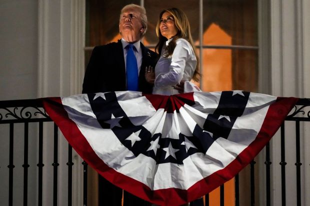 President Donald Trump and first lady Melania Trump watch fireworks from the Truman Balcony of the White House at the night of the Fourth of July celebrations. (Image: AP)