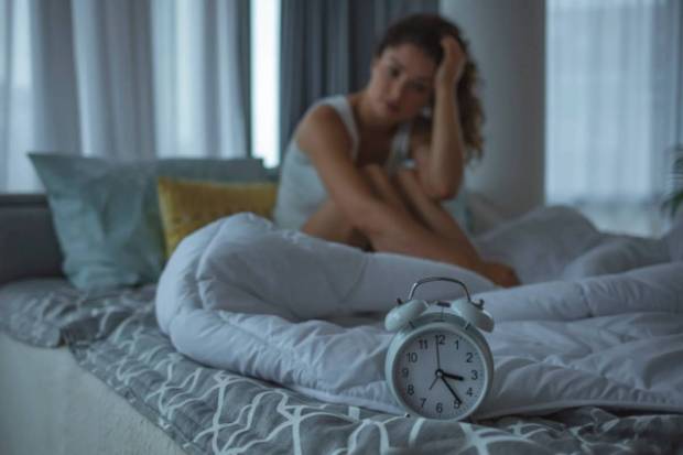 Lack of sleep can trigger cravings and can impact hunger hormones like leptin and ghrelin. (Photo source: Canva)