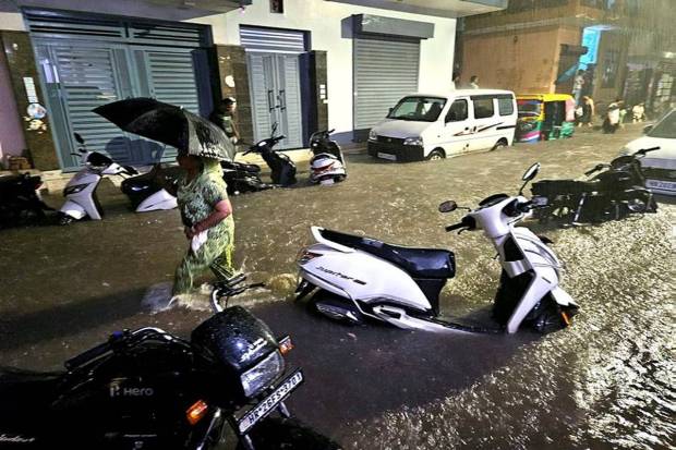 Gurugram came to a halt on Thursday as overnight showers resulted in waterlogging, flooding residential areas as well as roads while leading to heavy traffic jams across the city. (Photo source: PTI)