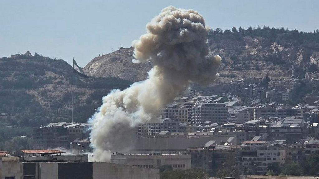 Smoke rises from an Israeli airstrike that hit the Syrian Defence Ministry (SANA via AP)