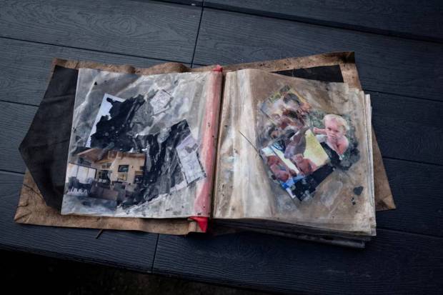 Volunteers have recovered personal belongings like family photos from the debris. (Photo source: AP)