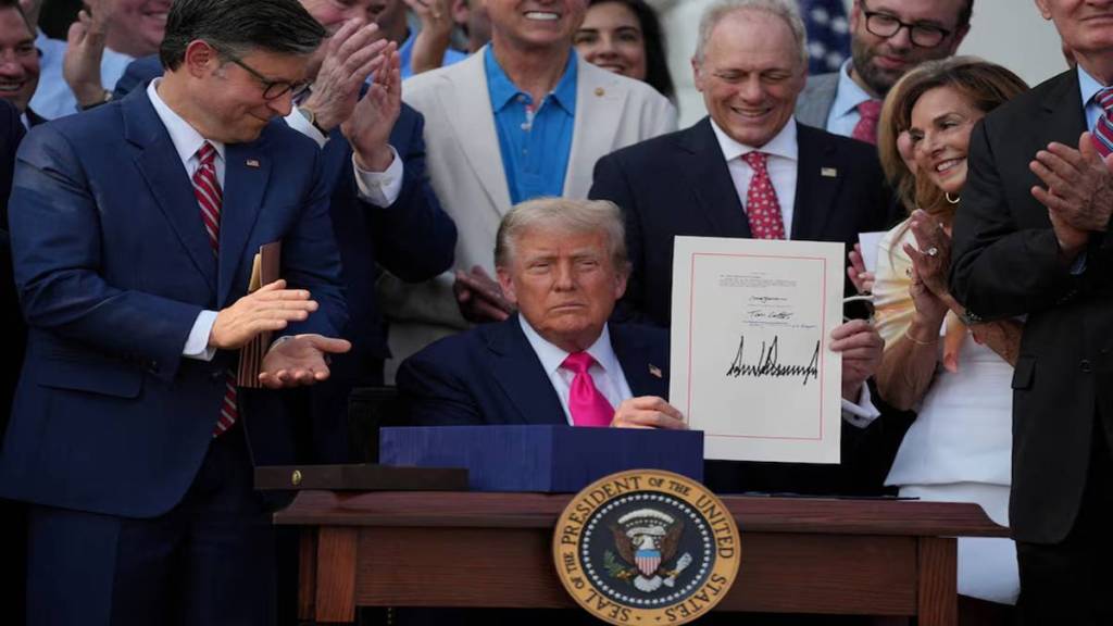 U.S. President Donald Trump presents a sweeping spending and tax legislation, known as the "One Big Beautiful Bill Act," after he signed it, at the White House in Washington, D.C., U.S., July 4, 2025.