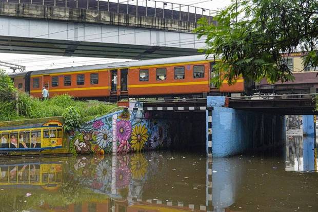 A train passes above a waterlogged underpass after rainfall, in Jalandhar, Punjab. (Photo source: PTI)