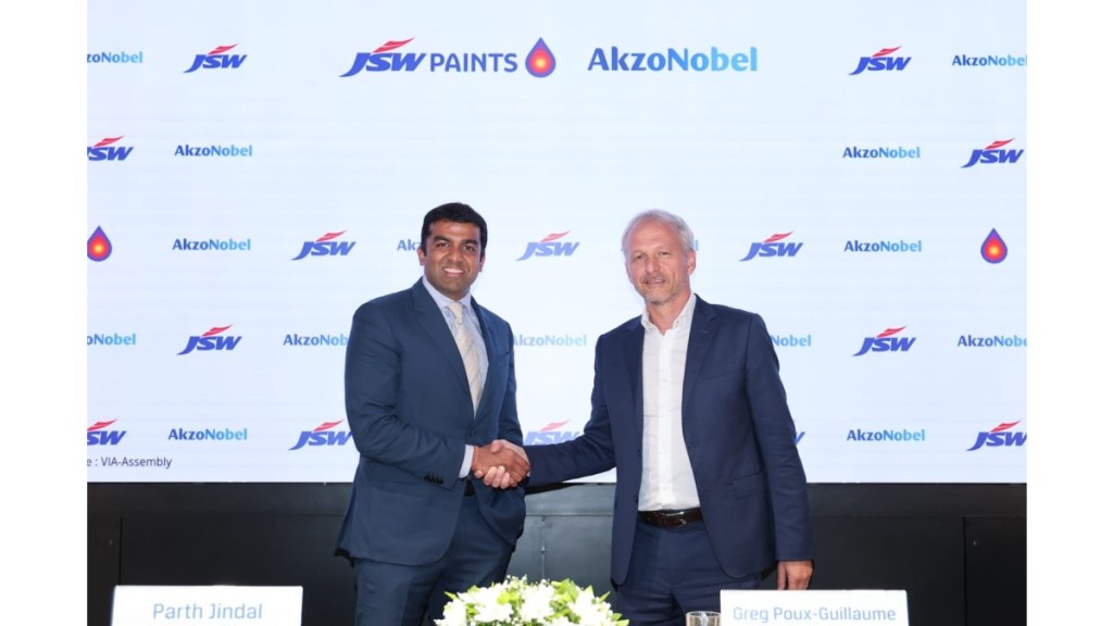 (L-R) Mr. Parth Jindal, Managing Director, JSW Paints shakes hand with Mr. Greg Poux-Guillaume, CEO, AkzoNobel during a joint press conference in Mumbai on Tuesday. Photo Credit: JSW Paints