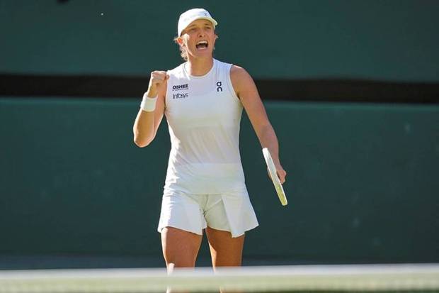 Poland's Iga Swiatek celebrates after beating Switzerland's Belinda Bencic during a women's singles semifinal match at the Wimbledon Tennis Championships. (Photo source: AP)
