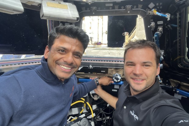 Captain Shukla and Mission Specialist Tibor Kapu share a moment admiring the breathtaking panoramic views of Earth from the iconic seven-windowed Cupola module aboard the ISS, capturing the awe-inspiring beauty of our planet from orbit. (Image source: Axiom Space)