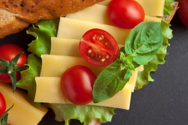 If you’ve ever had strange dreams after a wine and cheese night, this might explain why. Combined with the fat content, aged cheeses can also slow digestion, keeping your body working when it should be resting. (Image: Pixaby)