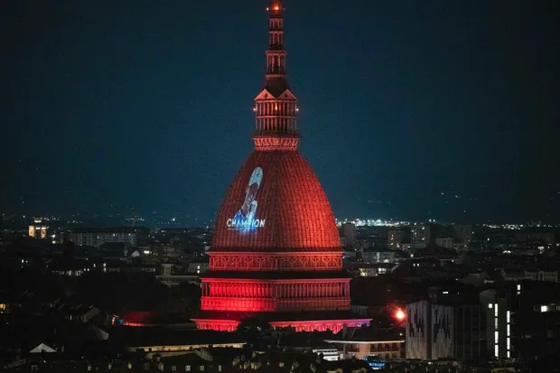 The Mole Antonelliana in Turin lights up in celebration of Jannik Sinner’s Wimbledon triumph. (Photo: AP)
