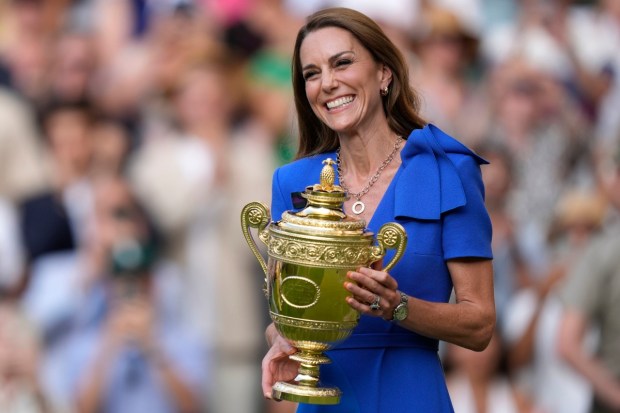Kate, Princess of Wales, smiles while holding the trophy during the presentation ceremony after Italy’s Jannik Sinner won the men’s singles final at Wimbledon in London. (Photo: AP)