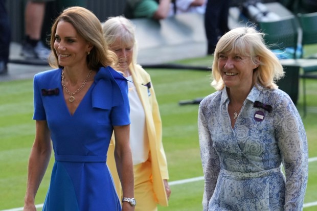 Britain's Kate, Princess of Wales is accompanied by Deborah Jevans of the All England Club during the presentation ceremony for the men's singles final at the Wimbledon Tennis Championships in London. (Photo: AP)