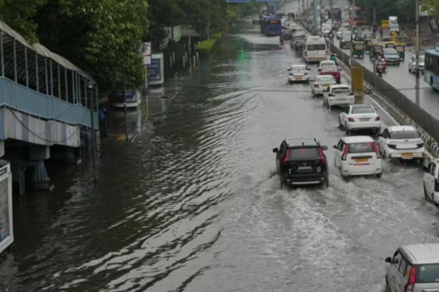 Vehicles struggle through a heavily waterlogged stretch in New Delhi after a spell of intense monsoon showers. (PTI Photo)