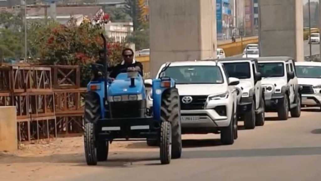 From fields to fortune: Farmer rolls up on a tractor to buy a Land Rover Defender