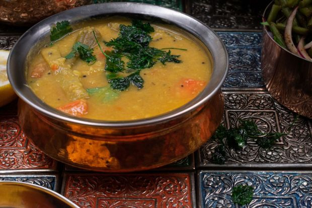 Sambhar: This lentil-based dish features vegetables like pumpkin, carrot, with flavours of tamarind and aromatic spices. (Image: Canva)