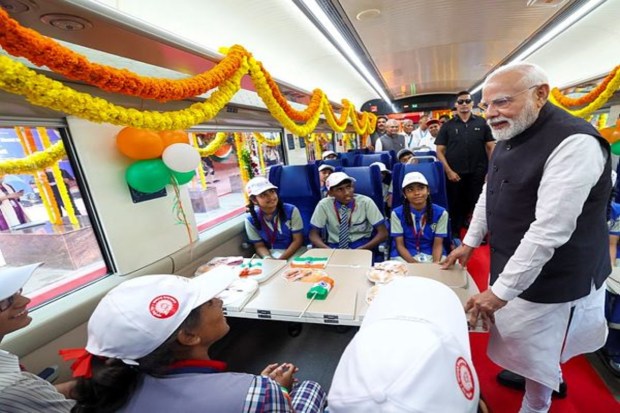 Prime Minister Narendra Modi interacted with students during the Vande Bharat Express train's flag-off ceremony from Bengaluru to Belagavi at KSR Railway Station. (Image Source: PTI)