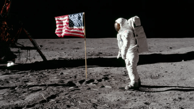 July 20, 1969: Neil Armstrong becomes the first human to step on the moon. Armstrong stands on the lunar surface beside the Apollo Lunar Module. His words—