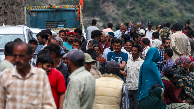People at the disaster-hit Chisoti village in India gather on streets accounting their loss in the aftermath of the flash flood triggered by a cloudburst, in Kishtwar district, Jammu and Kashmir on Friday. Photo Source: PTI)  