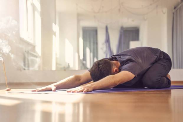 Balasana (Child’s pose)- It is a resting yoga posture and it gently presses the abdomen. Holding on this pose helps in unleashing trapped gas and ease tension. (Photo source: Canva)