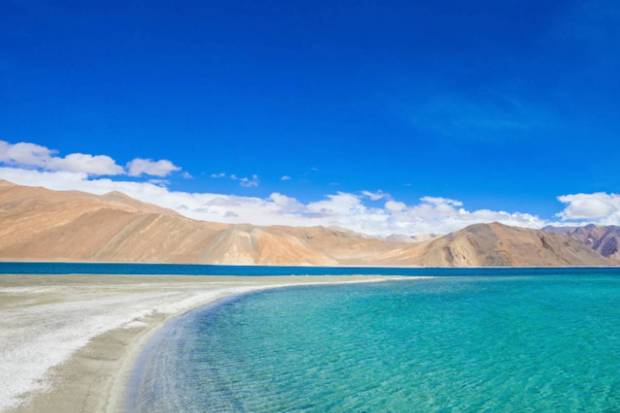 Leh, Ladakh: Located in a rain-shadow, Leh usually remains dry during monsoon, and offers clear views, lesser crowds, and high-altitude greenery. (Photo source: Canva)