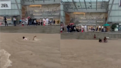 Boy swims in front of Goregaon mall as heavy rains flood Mumbai streets – video