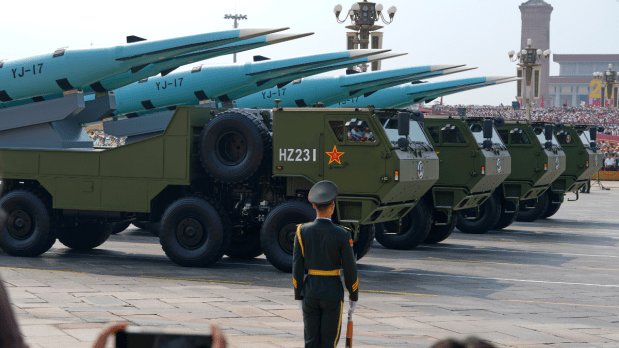  The nuclear triad including land, sea and air-based deterrents featured prominently. Overhead, fighter jets and helicopters flew in formation, while 80,000 doves were released to symbolise peace.  (Photo Source: Associated Press)