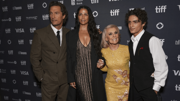 Matthew McConaughey (from left), Camila Alves, Kay McConaughey, and Levi McConaughey arrive arm-in-arm for the “The Lost Bus” premiere, capturing a family affair under festival lights.