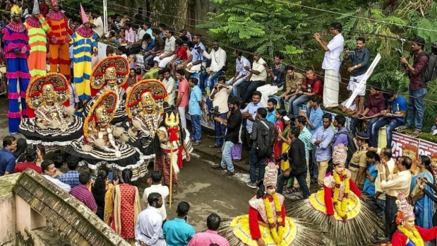 People carry idols of lord Shiva marking the first the day of Onam celebrations. Onam is a harvest festival which celebrates the homecoming of the legendary King Mahabali. During Onam, which generally falls in late August or early September, Kerala is decked up with pookkalam and lights. (Photo Source: PTI)